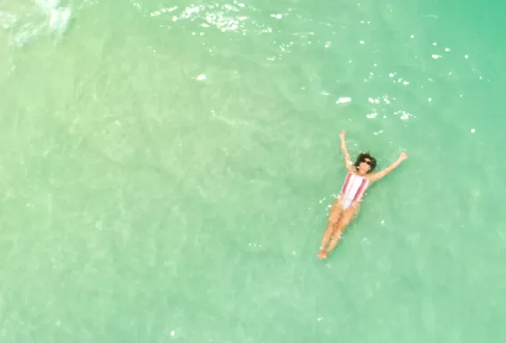 Women laying on the seashore